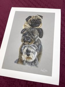 Print of a pug with two wheaton-like terriers, with their heads lay on top of each other