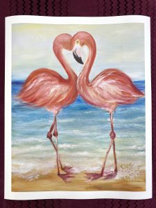 Print of two flamingos touching their foreheads into the shape of a heart on a beach